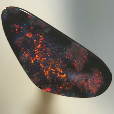 SOLID BLACK OPAL Red fire moves between black opal